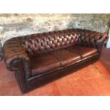 3 seat button back Chesterfield settee in oxblood red