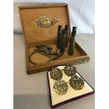 A collection of RAF Cap badges, Brass cuff & WW2 Shells