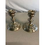 A pair of Birmingham silver candle sticks by W I Broadway & Co. 11.5cm in height.