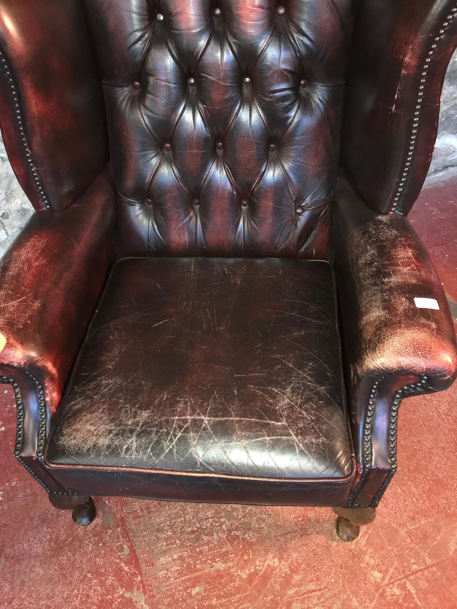 Ox blood red chesterfield gull wing chair.Left arm needs attention. As seen in the photographs - Image 2 of 3