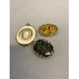 2 Victorian Mourning brooches. Largest of the two is 9ct gold. Together with oriental carved stone