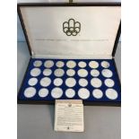 Silver Canadian Olympic coin set for the year 1976. 28 coins displayed In a case with certificates