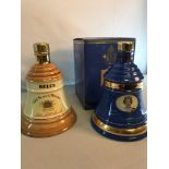 2 Bell's Scotch Whisky decanters, both are sealed and full. One with a box