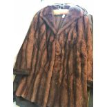 A Vintage musquash fur coat by Dominion Fur & co Ltd. Excellent condition