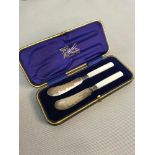 Sheffield silver knife set with mother of pearl handles fitted in a blue velvet interior box. Makers