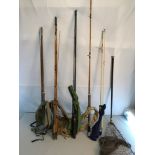 A collection of various fishing rods and landing net to include Ryobi Astroblack rod, S Allcocks 3