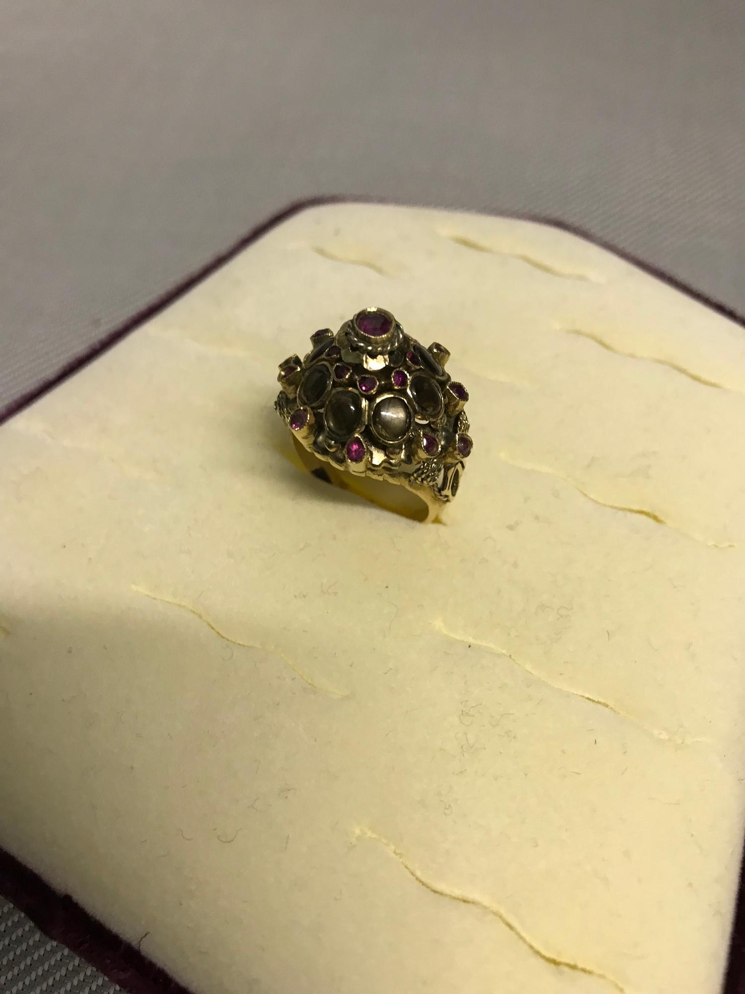 14Kt gold ladies ornate design ring, encrusted with ruby and tiger eye stone setting