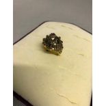 14Kt gold ladies ornate design ring, encrusted with ruby and tiger eye stone setting