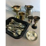 A collection of silver plated wares to include flat wares, drinking cup and various brass wares
