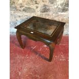 Dark wood side table with glass top