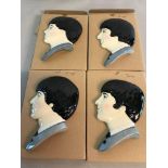 A set of 4 Beatles Moorland pottery masks