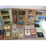 A collection of vintage scrap books, postcards, pictures and old beer labels etc