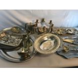 A collection of silver plated and EP wares to include serving trays, swing handle basket etc