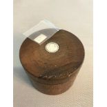 Wooden storage box fitted with silver coin to the top. Box measures 6x8cm. Together with 1 Gram fine