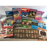 A collection of 1970's & 80's Rangers & Scotland football programmes together with cigarette
