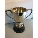 Large London Silver 2 Handled trophy cup. dated 1903. comes with a hard wood stand. Measures 30.