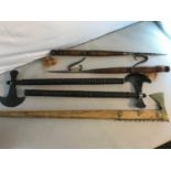 A Collection of reproduction battle axes and weapons