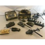 A Collection of Corgi & Solido tank models together with die cast heavy helicopters and figures