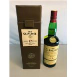 The Glenlivet 12 years of age single malt scotch whisky with leather presentation box. Full &