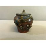Antique Japanese Sumida Gawa Pottery lidded jar depicting Monkeys. Stands 14cm in height.