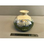 Signed Lise B Moorcroft, Moorland Staffordshire Chelsea works Burslem blue daisy design vase. Stands