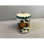 G. Hill Pottery Wemyss ware, Hand painted orange design preserve pot with lid. Stands 17cm in height