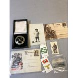A Selection of Military items which includes German badge within a fitted case, Various postcards