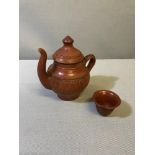 Old Terracotta tea pot with small drinking beaker
