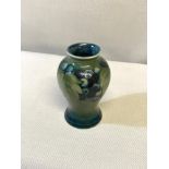 Small Moorcroft vase 'Leaf & Berries' in a green & blue colouring, designed by William Moorcroft,