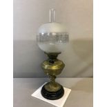 Victorian Ornate brass base paraffin lamp with ornate glass shade.