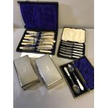 2 EP Four foot cigarette boxes together with 2 Mother of pearl handled cutlery sets & ornate knife