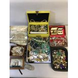 A Large collection of costume jewellery which includes a tray full of earrings, Cufflinks, Necklaces