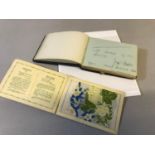 Old 1920's autograph book filled with various poem's, sayings and pictures together with silk flower