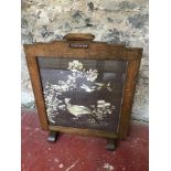 1920's oak framed fire guard depicting silk bird tapestry.