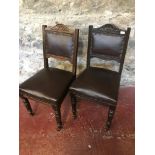 A Pair of 1940's solid wood and leather chairs.