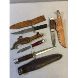 A Collection of 4 Hunting knifes with scabbards which includes Norway blade.