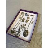 A Collection of silver jewellery which includes chains with pendants, Charms and ring