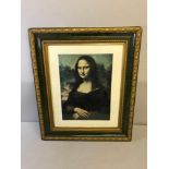 A print of The Mona Lisa within an antique ornate frame
