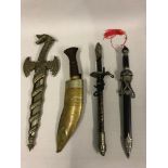 A mixed collection of display daggers, together with an aged kukri knife