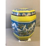 Oriental ceramic stool, done in vibrant blue and yellow colours. Measures 46cm in height.