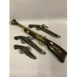 A collection of replica flintlock pistols and boom stick