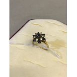 Birmingham 9ct gold ladies dress ring set with clear stones and sapphires. Weighs 4.13grams