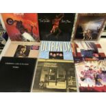 A Box full of records which include various artists such as Elton John, Ultrvox, Bruce Springsteen