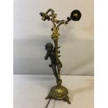 A Large Spelter cherub and gilt foliage design table lamp. Measures 57cm in height