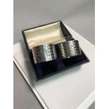 A Pair of Birmingham silver napkin rings. Makers Docker & Burns. Dated 1923. Fitted in a display