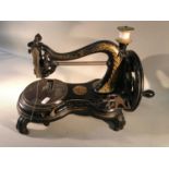 A Jones Hans Victorian sewing machine, 24cm in height, 39cm in width