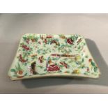 A 19th century Famille Rose porcelain dish, hand painted with birds, butterflies and foliage,