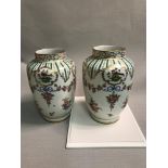 A Pair of Dresden hand painted flower and bird design vases. 20cm in height.