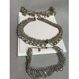 3 Various sized white metal necklaces