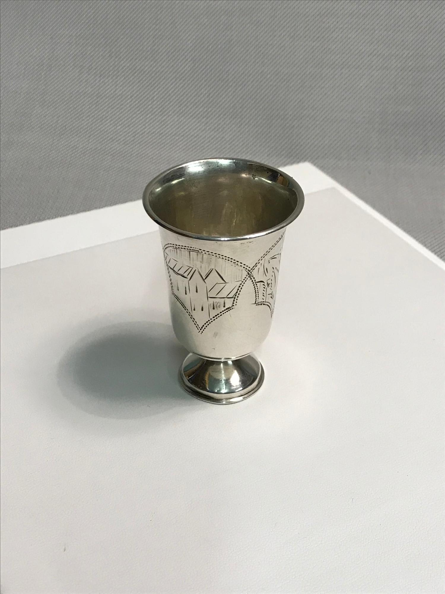 Silver vodka shot glass. Measures 6cm in height.